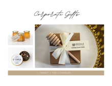 Corporate gift items including honey, tea, and candles by Lulu Island Honey