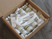 Shipping box containing candles by Lulu Island Honey