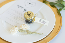 Small jar of tea with a gold lid on a white plate by Lulu Island Honey