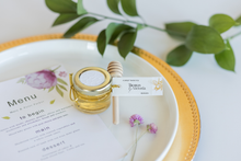1 oz honey jar in luxe style with white tags and gold loops, handmade by Lulu Island Honey. Perfect for wedding favours or tea parties.