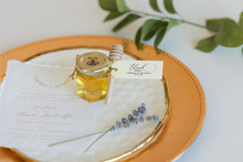 2 oz honey jar in classic style with cream tag and gold loops, handmade by Lulu Island Honey. Perfect for wedding favors or tea parties.