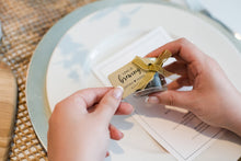 Loose-leaf rose blend tea in a mini glass jar with vintage-style label from Lulu Island Honey